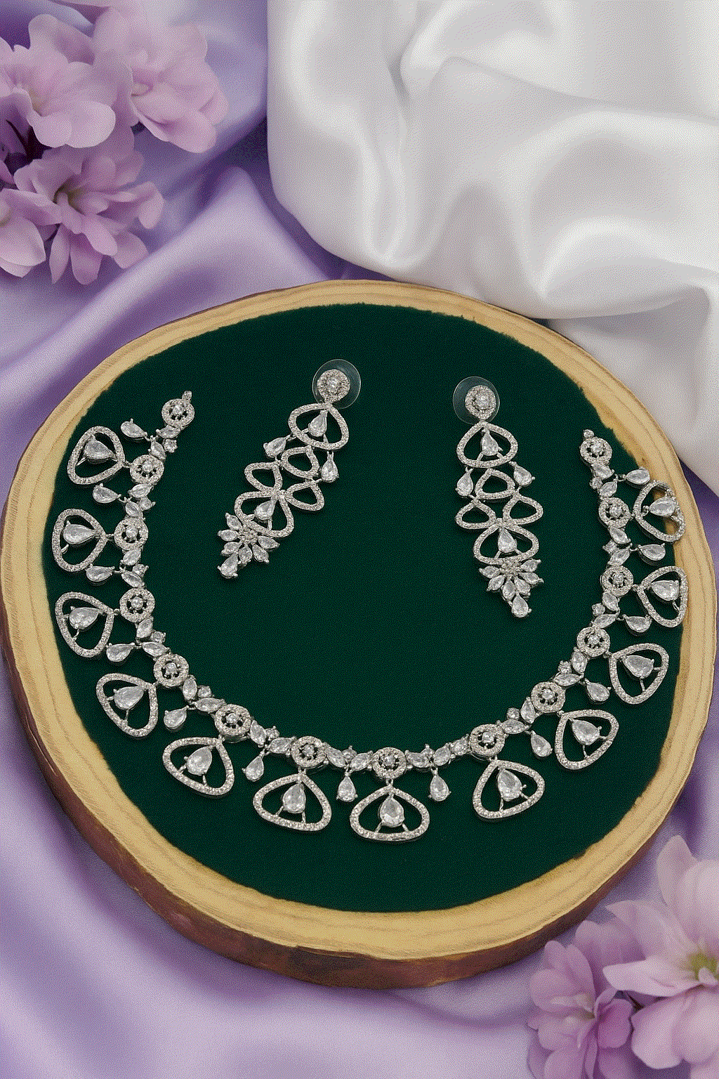 Intimate Bridal CZ Necklace Set with silver-plated elegant teardrop earrings on green velvet display