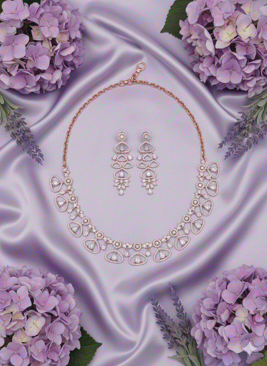 Rose gold plated intimate jewelry set with CZ floral drop link necklace and statement earrings on lavender satin with purple flowers
