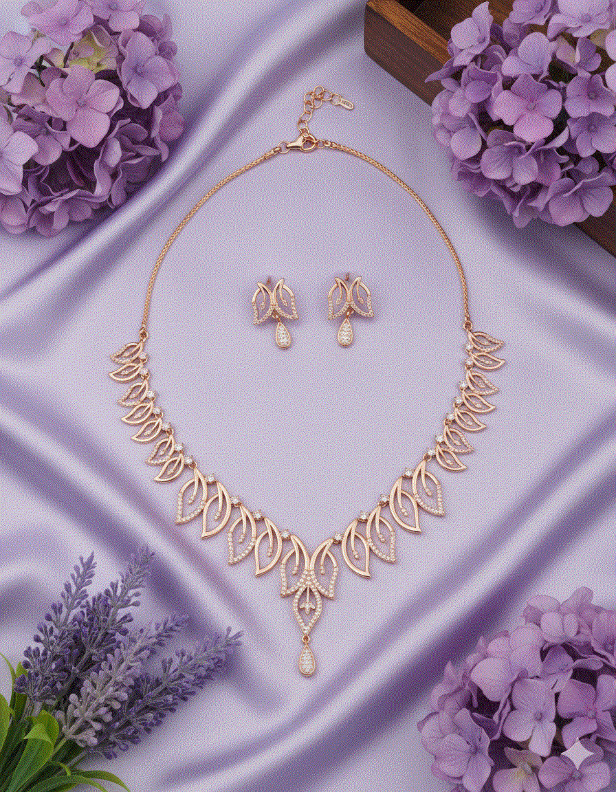Majestic Intimate Jewelry rose gold plated necklace and earrings set on purple silk with floral accents