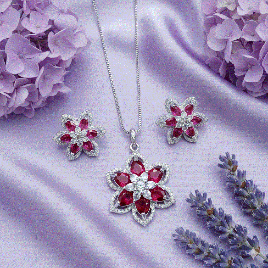 Romantic intimate jewelry set with red floral pendant and matching earrings, luxury CZ stones, rhodium plated on purple silk background