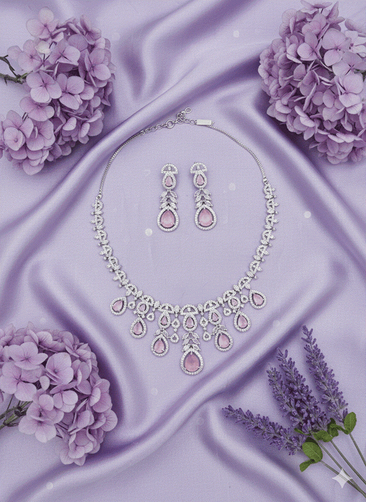 Luxury pink cubic zirconia geometric choker and drop earrings set on lavender silk with flowers, intimate jewelry style