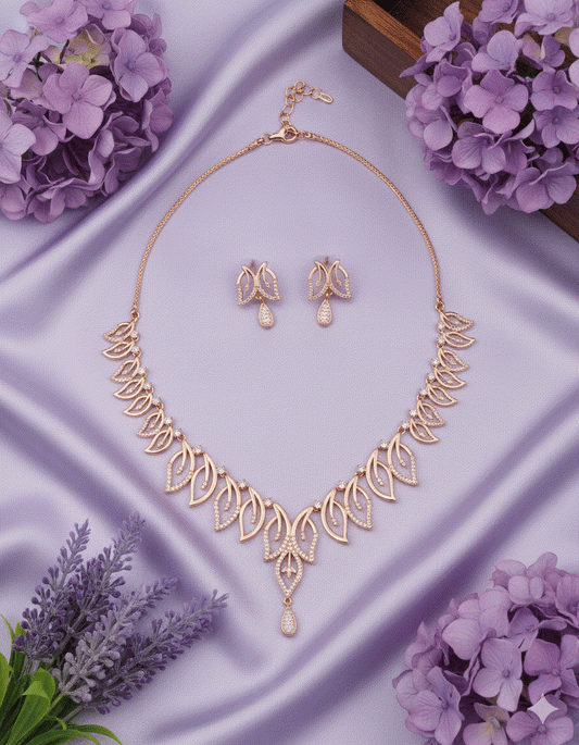 Majestic Intimate Jewelry rose gold plated necklace and earrings set on purple silk with floral accents