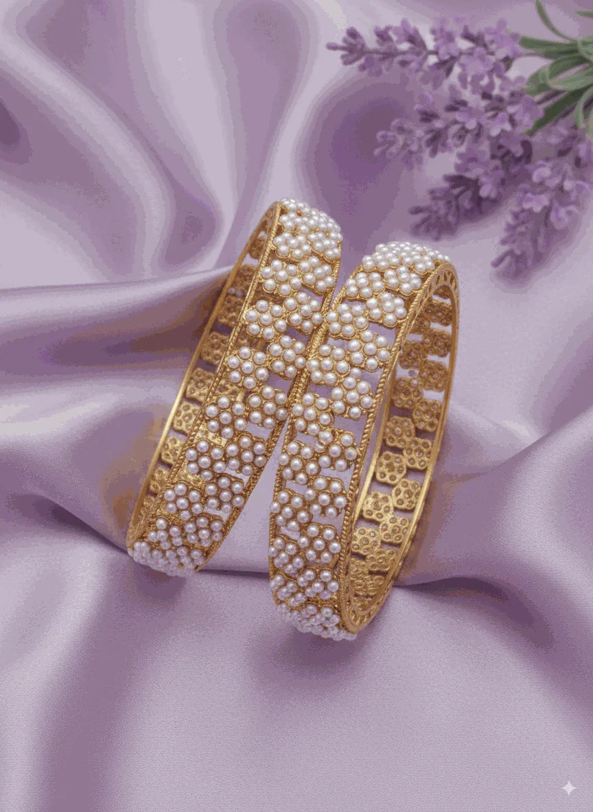 Opulent Intimate Jewelry gold plated kundan-style bridal pearl bangles on purple silk background