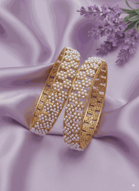 Opulent Intimate Jewelry gold plated kundan-style bridal pearl bangles on purple silk background