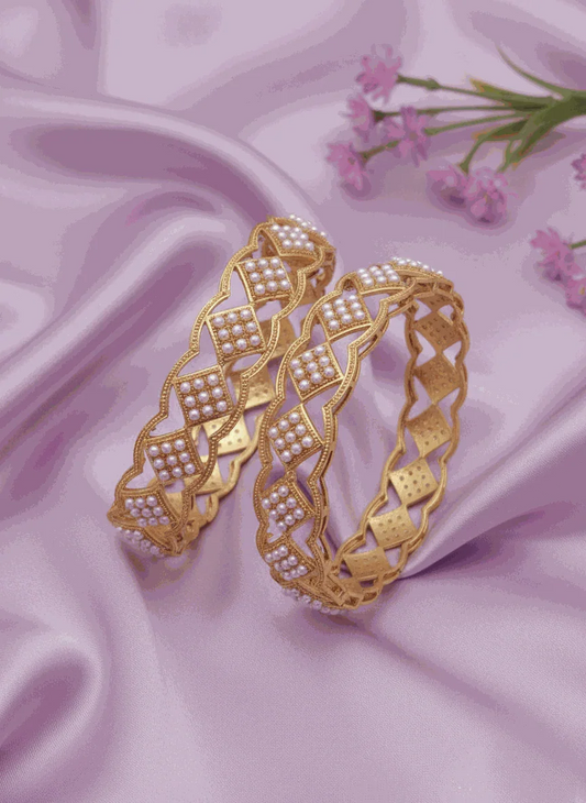 Luxury pearl intimate jewelry bangles gold plated bridal kada set with lattice design on pink satin background