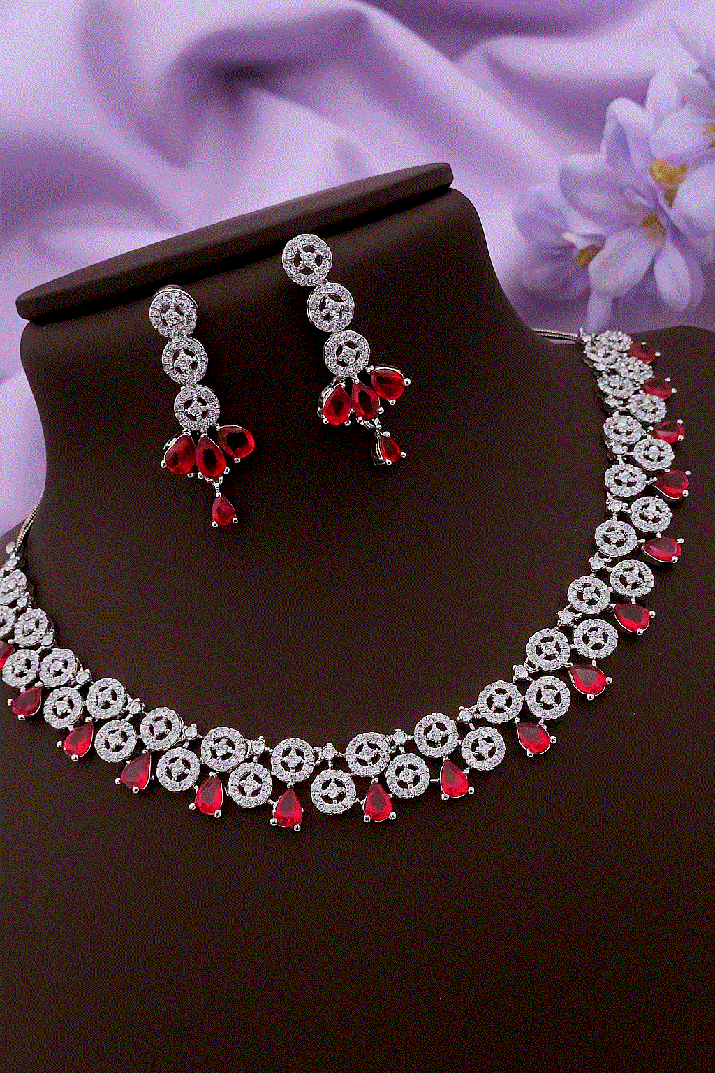 Passionate Ruby Red CZ diamond silver-toned bridal necklace and drop earrings set with teardrop red stones and sparkling micro-pave cubic zirconia.