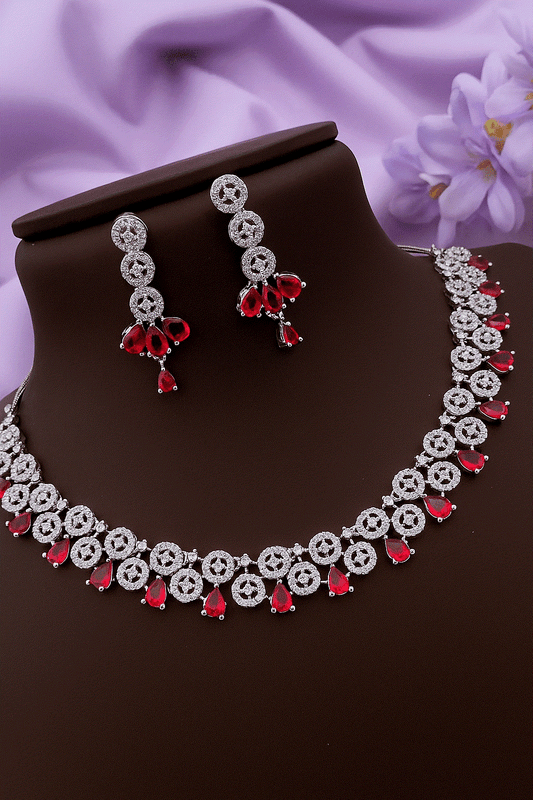 Passionate Ruby Red CZ diamond silver-toned bridal necklace and drop earrings set with teardrop red stones and sparkling micro-pave cubic zirconia.