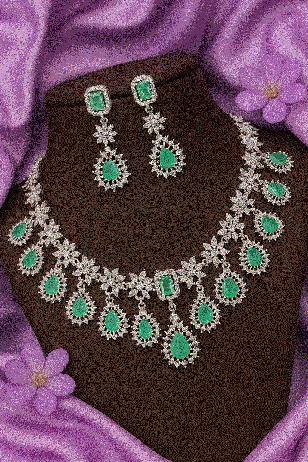Luxury CZ Intimate Jewelry Set featuring emerald green gemstones with rhodium floral design necklace and matching earrings