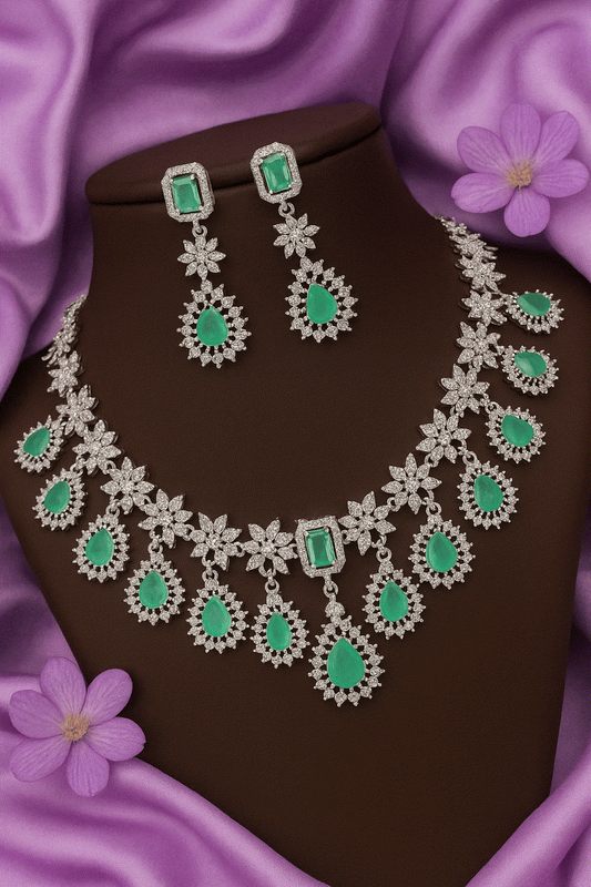 Luxury CZ Intimate Jewelry Set featuring emerald green gemstones with rhodium floral design necklace and matching earrings